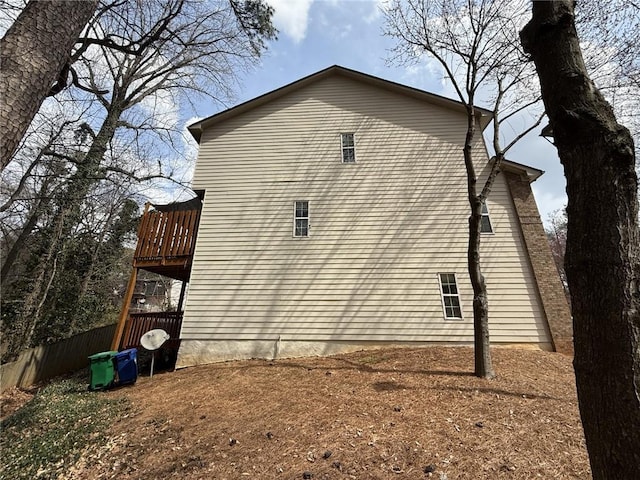 view of property exterior featuring fence