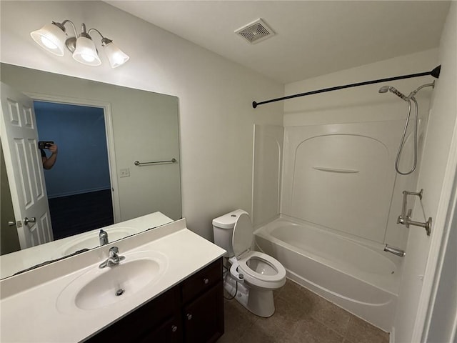 full bathroom with vanity, washtub / shower combination, visible vents, tile patterned floors, and toilet