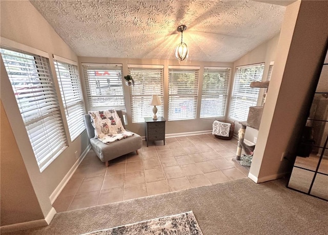 unfurnished room with tile patterned flooring, lofted ceiling, and a textured ceiling