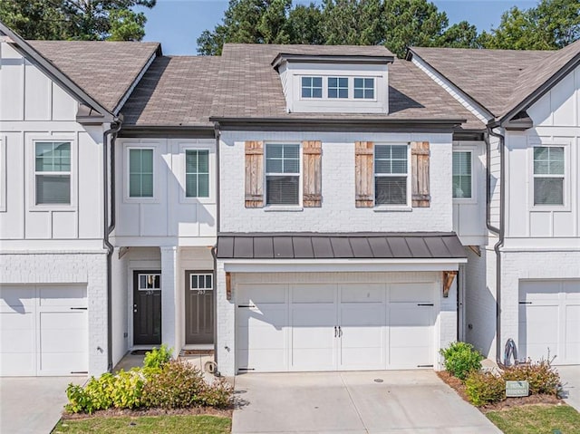 townhome / multi-family property featuring a garage