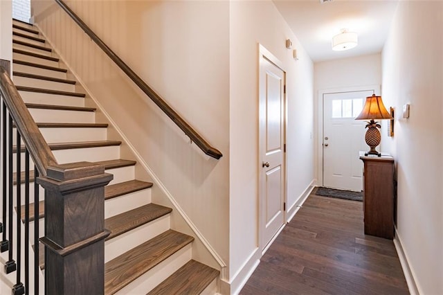 stairs with hardwood / wood-style floors