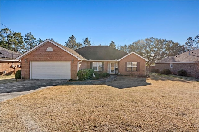 ranch-style home with a front yard and a garage