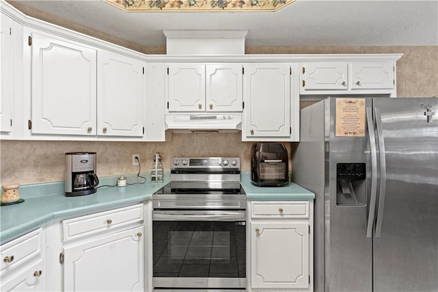 kitchen featuring tile patterned floors, white cabinets, and stainless steel appliances