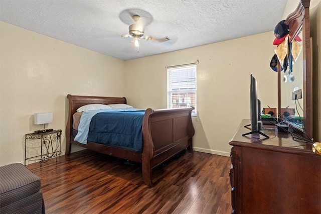 bedroom featuring a textured ceiling, ceiling fan, and dark wood-type flooring