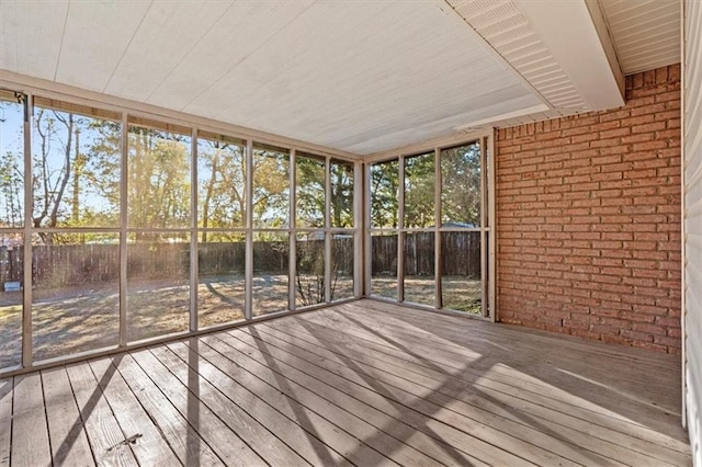 unfurnished sunroom featuring a healthy amount of sunlight