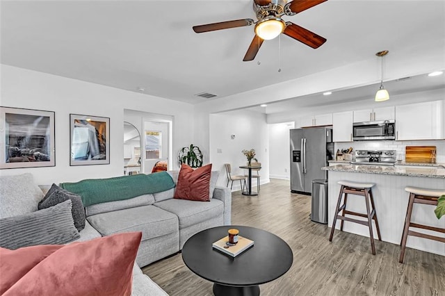2912 Palm Dr, East Point, GA 30344 - living room with light wood-style flooring, a ceiling fan, recessed lighting, and baseboards