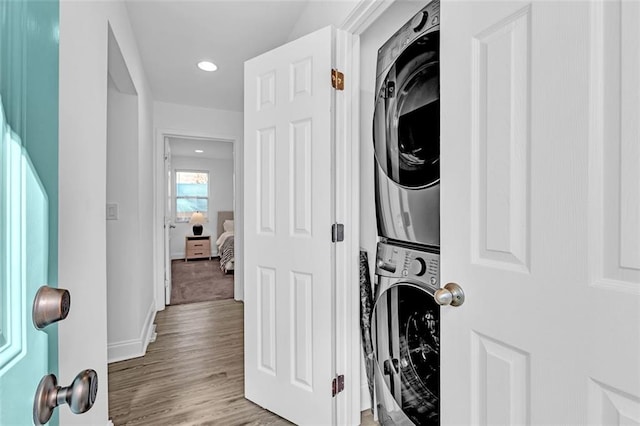 2912 Palm Dr, East Point, GA 30344 - laundry room with stacked washer / dryer, recessed lighting, light wood finished floors, and baseboards