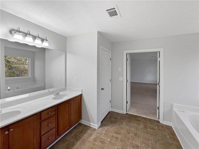 bathroom featuring vanity and a bathtub