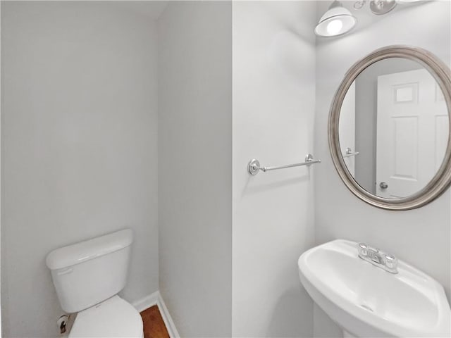 bathroom with toilet and sink