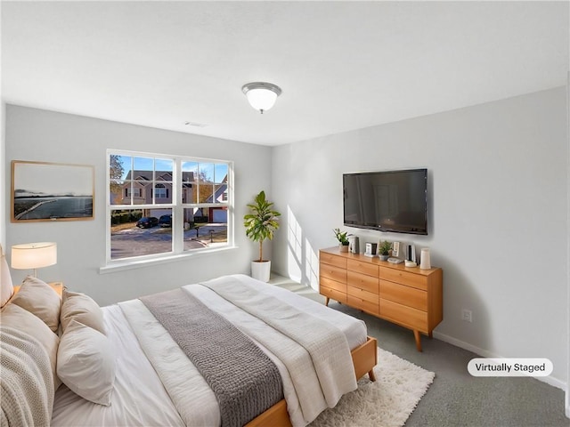 bedroom featuring carpet