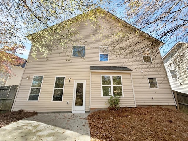 rear view of property featuring a patio