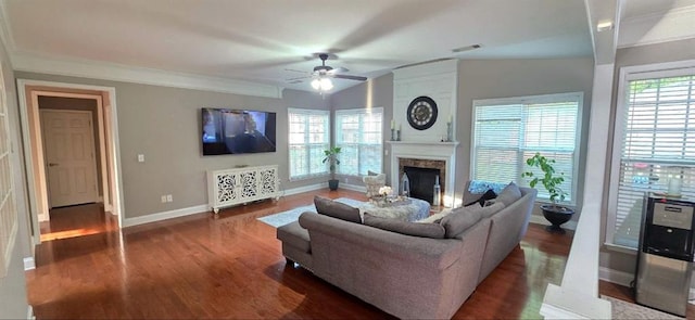779 Avonley Creek Trce, Sugar Hill, GA 30518 - living room featuring wood finished floors, ceiling fan, a premium fireplace, baseboards, and ornamental molding