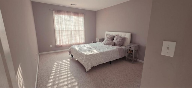 779 Avonley Creek Trce, Sugar Hill, GA 30518 - bedroom featuring light colored carpet and baseboards