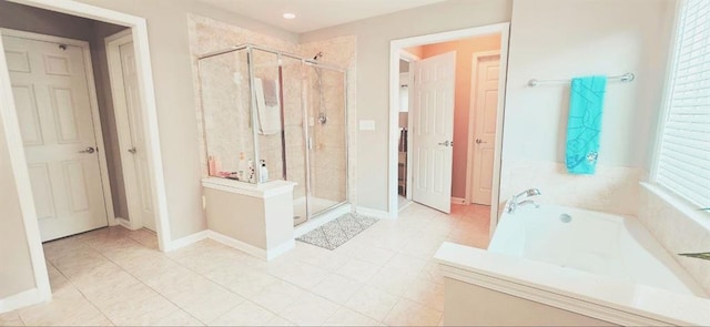 779 Avonley Creek Trce, Sugar Hill, GA 30518 - full bath with a shower stall, tile patterned flooring, a bath, and baseboards