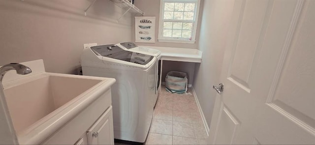 779 Avonley Creek Trce, Sugar Hill, GA 30518 - laundry room with light tile patterned floors, washing machine and dryer, cabinet space, and baseboards