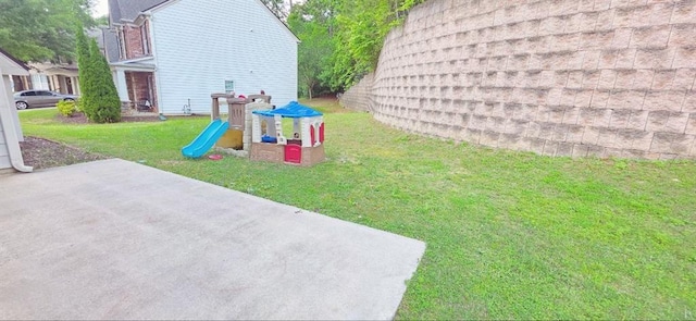 779 Avonley Creek Trce, Sugar Hill, GA 30518 - view of grassy yard featuring a playground and a patio area