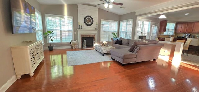 779 Avonley Creek Trce, Sugar Hill, GA 30518 - living room featuring ceiling fan, baseboards, wood finished floors, plenty of natural light, and lofted ceiling