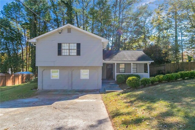 split level home with a front lawn