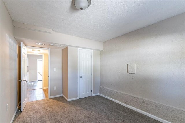 unfurnished bedroom with carpet floors
