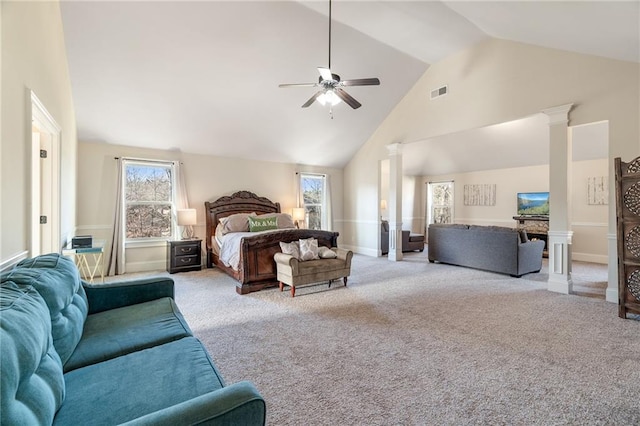 carpeted bedroom with visible vents, baseboards, decorative columns, a ceiling fan, and high vaulted ceiling
