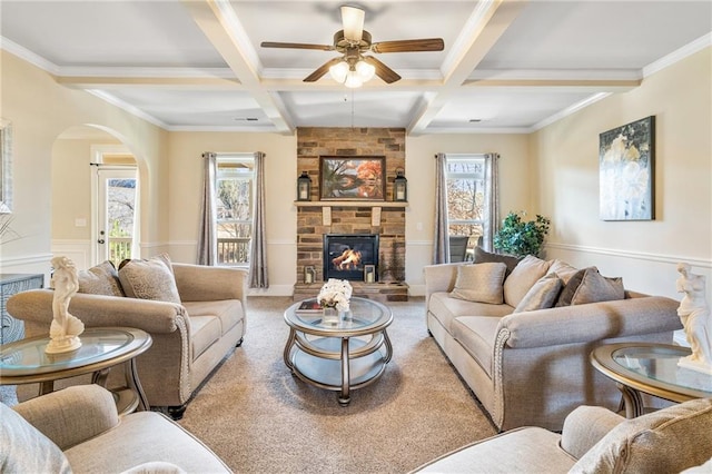 carpeted living room with ceiling fan, coffered ceiling, and beamed ceiling