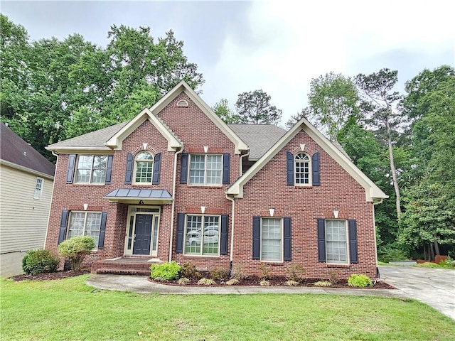 1988 Greensferry Gln, Lawrenceville, GA 30043 - view of front of property with a front yard and brick siding