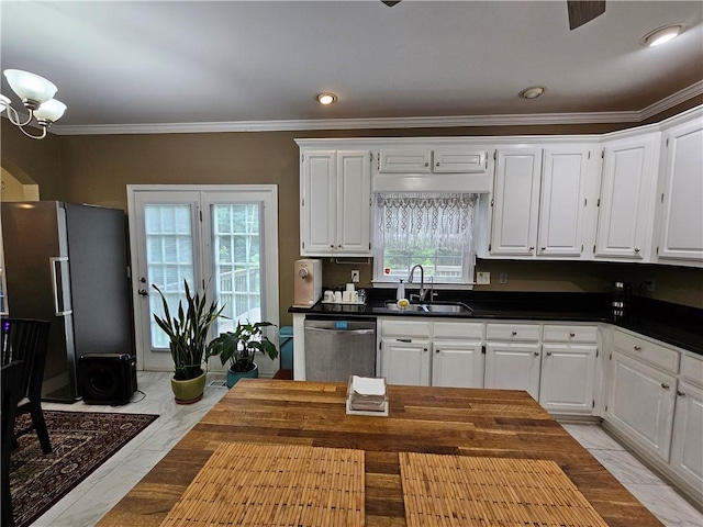 1988 Greensferry Gln, Lawrenceville, GA 30043 - kitchen featuring appliances with stainless steel finishes, a sink, light marble finish floors, dark countertops, and ornamental molding