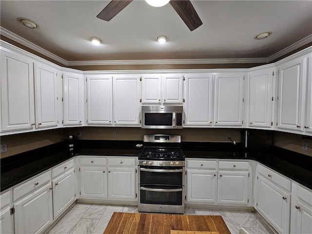 1988 Greensferry Gln, Lawrenceville, GA 30043 - kitchen featuring stainless steel appliances, light marble finish flooring, dark countertops, ceiling fan, and ornamental molding