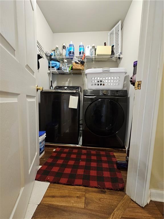 1988 Greensferry Gln, Lawrenceville, GA 30043 - washroom with washing machine and dryer and baseboards
