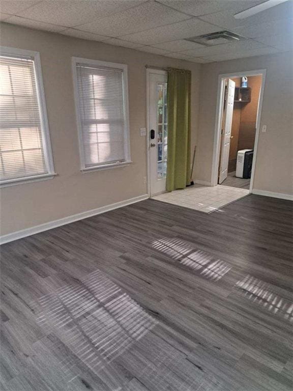 1988 Greensferry Gln, Lawrenceville, GA 30043 - empty room with baseboards, a paneled ceiling, and wood finished floors