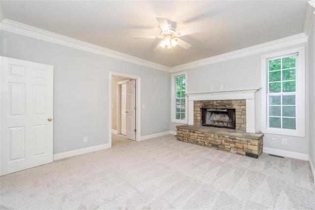 unfurnished living room with ornamental molding, carpet floors, a ceiling fan, and baseboards