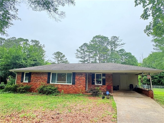 5167 Hiram Lithia Springs Rd, Powder Springs, GA 30127 - ranch-style house with concrete driveway, a carport, and brick siding