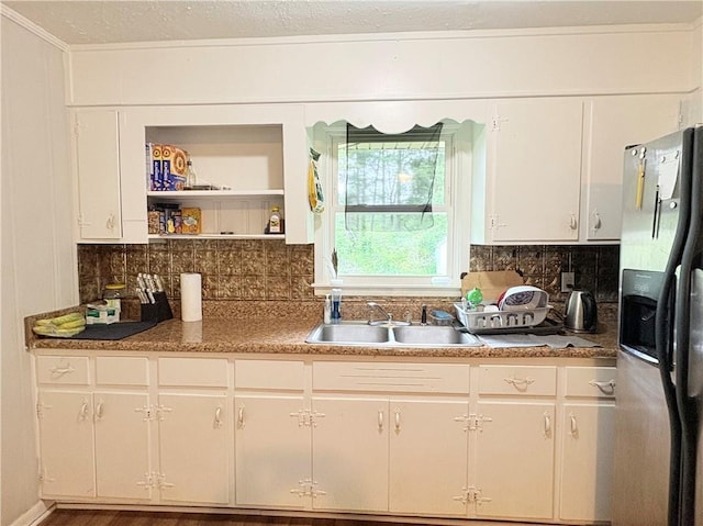 5167 Hiram Lithia Springs Rd, Powder Springs, GA 30127 - kitchen with refrigerator with ice dispenser, a sink, tasteful backsplash, open shelves, and white cabinets