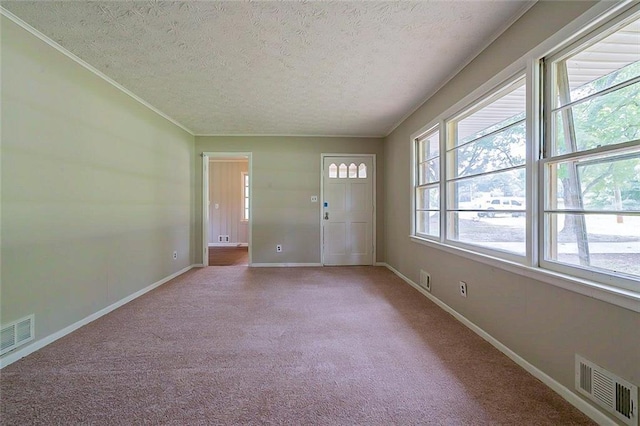 5167 Hiram Lithia Springs Rd, Powder Springs, GA 30127 - carpeted foyer featuring a textured ceiling, baseboards, and crown molding