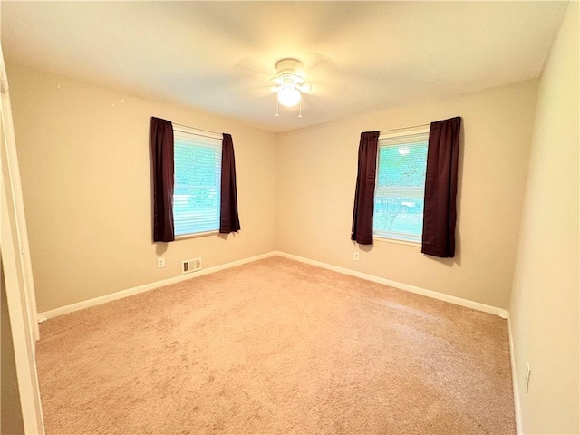 5167 Hiram Lithia Springs Rd, Powder Springs, GA 30127 - spare room with carpet floors, a ceiling fan, and baseboards