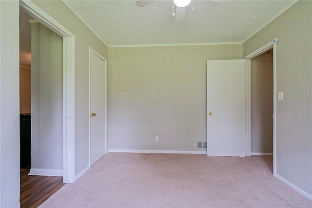 5167 Hiram Lithia Springs Rd, Powder Springs, GA 30127 - unfurnished bedroom with crown molding, carpet flooring, baseboards, and ceiling fan