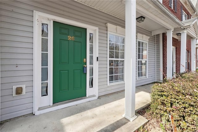 property entrance featuring covered porch