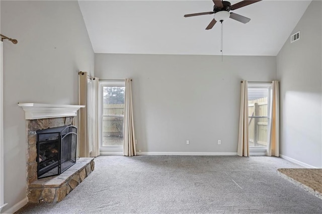 unfurnished living room featuring carpet, a fireplace, visible vents, and ceiling fan