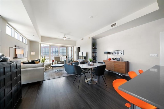 dining space featuring ceiling fan and dark wood-type flooring