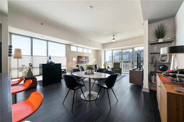 dining area featuring dark hardwood / wood-style floors and ceiling fan