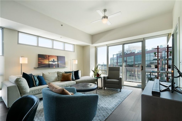 living room featuring ceiling fan and hardwood / wood-style floors