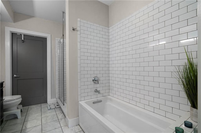 bathroom featuring tile patterned flooring and toilet