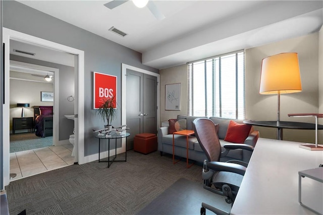 office space featuring ceiling fan and light tile patterned floors