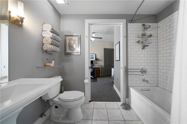 bathroom featuring ceiling fan, toilet, and shower / bathtub combination with curtain