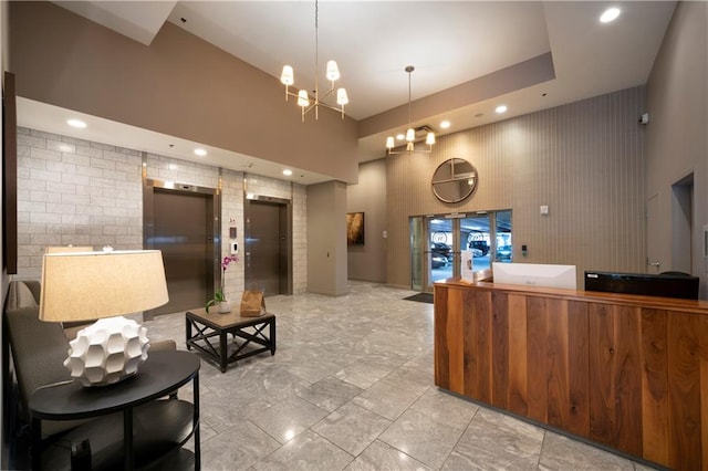 reception with french doors and a notable chandelier