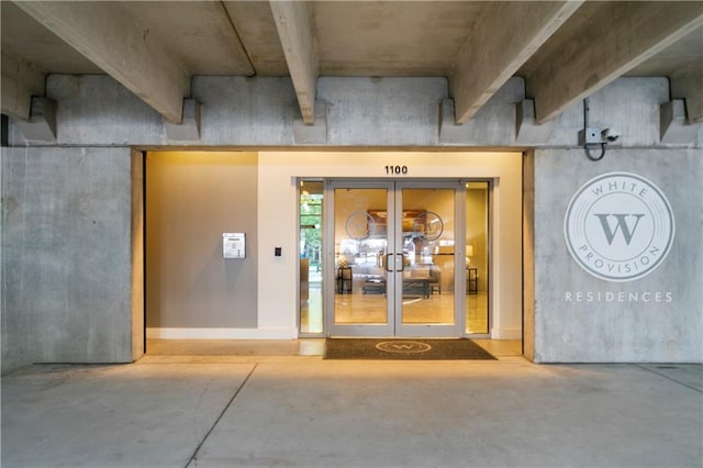 view of exterior entry featuring french doors