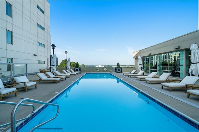 view of swimming pool featuring a patio area