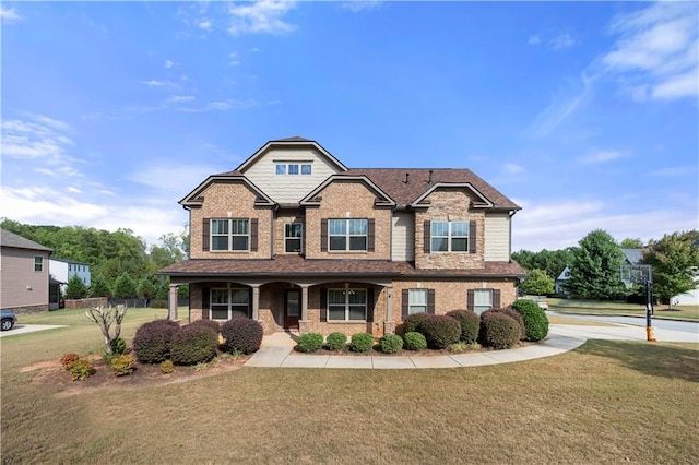 craftsman-style home with a front lawn