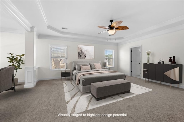 carpeted bedroom with multiple windows, a tray ceiling, and crown molding