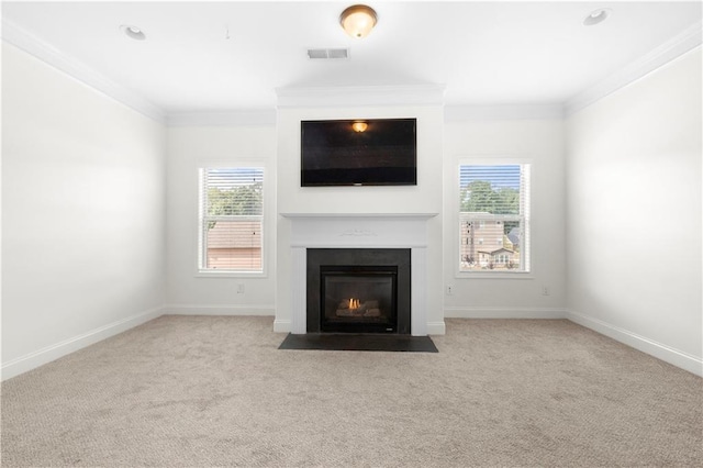 unfurnished living room featuring crown molding and light carpet